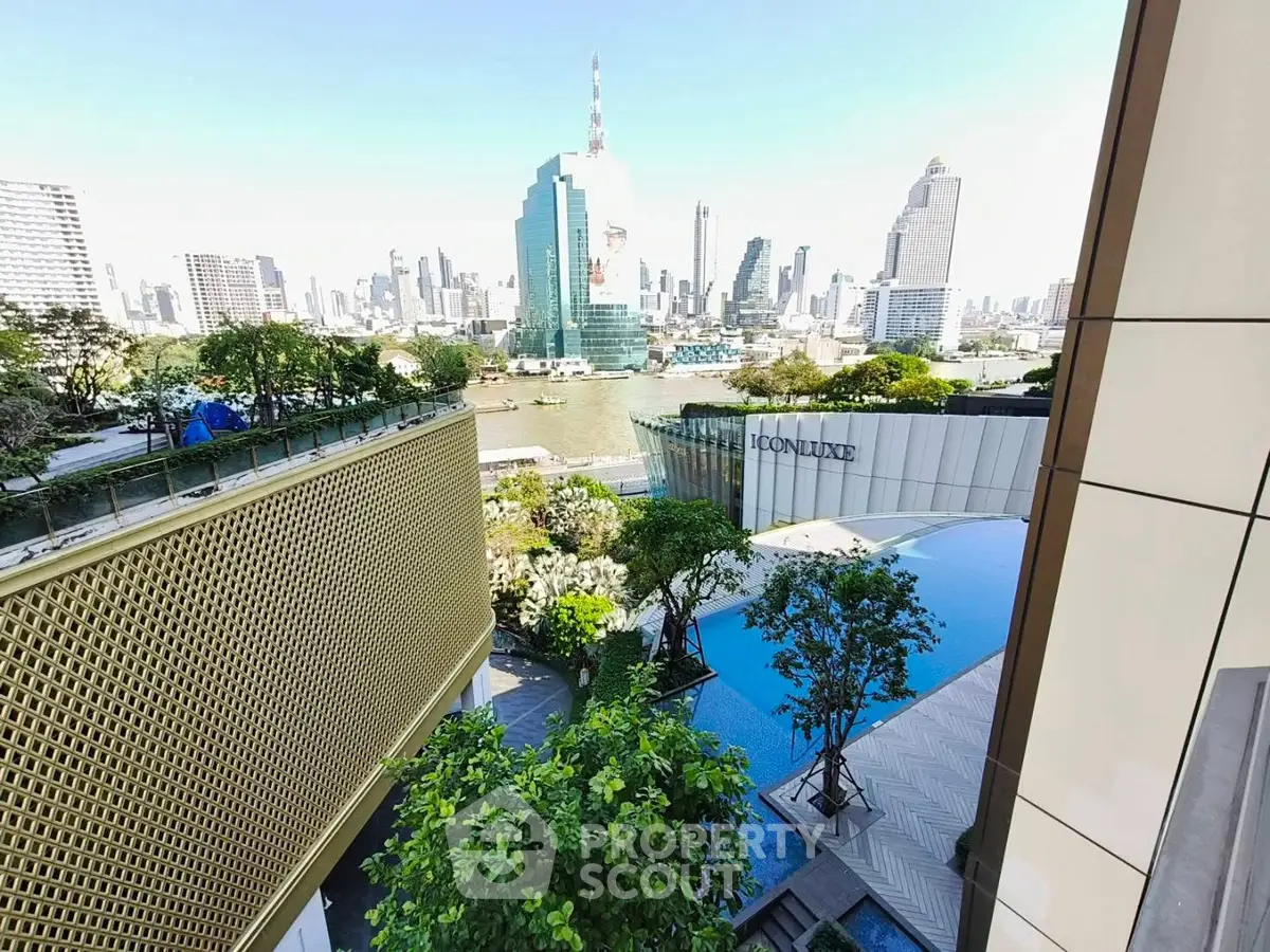 Stunning cityscape view from a modern balcony overlooking a river and skyline.