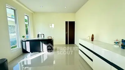 Bright modern study room with sleek desk and large windows