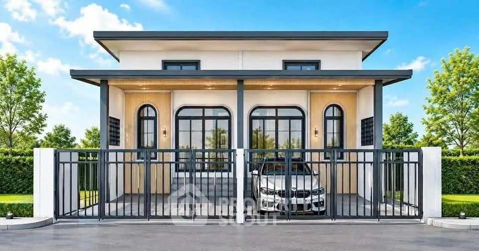 Modern single-story house with sleek design and gated driveway, featuring large windows and lush greenery.