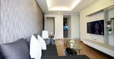 Modern living room with sleek design and wall-mounted TV