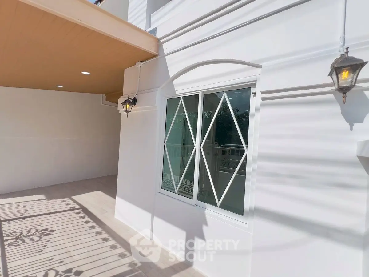 Charming exterior with elegant lighting and modern window design