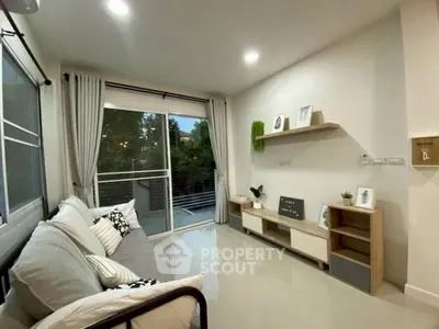 Modern living room with large windows and stylish decor