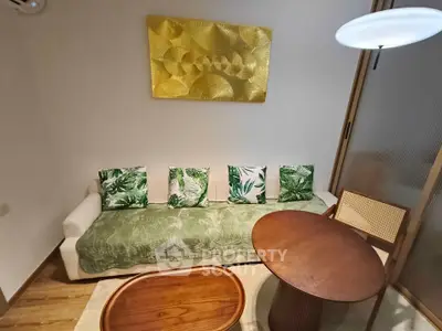 Charming living room with stylish decor and cozy seating area, perfect for relaxation and entertaining.