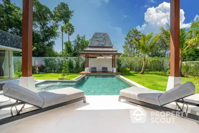 Luxurious tropical villa with private pool and lush garden, perfect for relaxation and leisure.