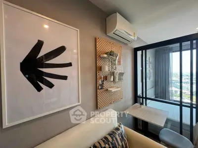 Modern living room with stylish decor and city view, featuring air conditioning and cozy seating area.