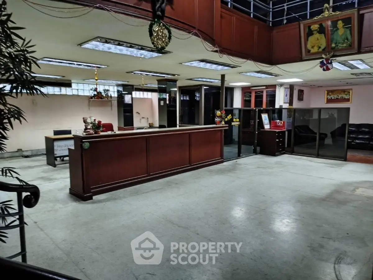Spacious office lobby with reception desk and modern decor