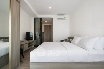 Modern bedroom with sleek design and cozy ambiance