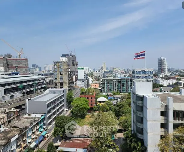 Stunning cityscape view showcasing urban development and skyline with clear blue skies.