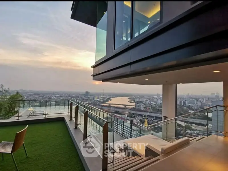 Stunning rooftop view with modern architecture and cityscape panorama at sunset.