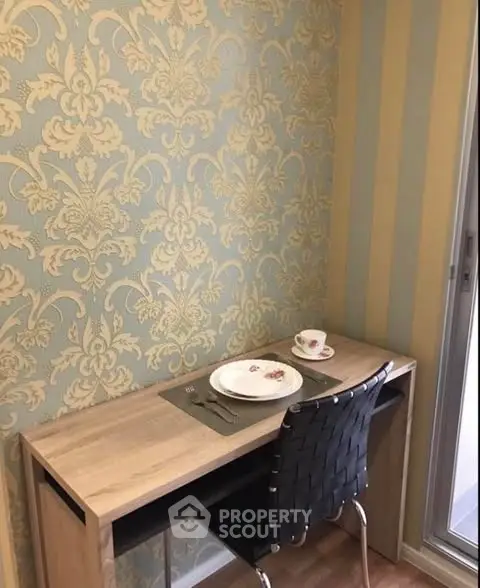 Chic study nook with elegant wallpaper and modern desk setup