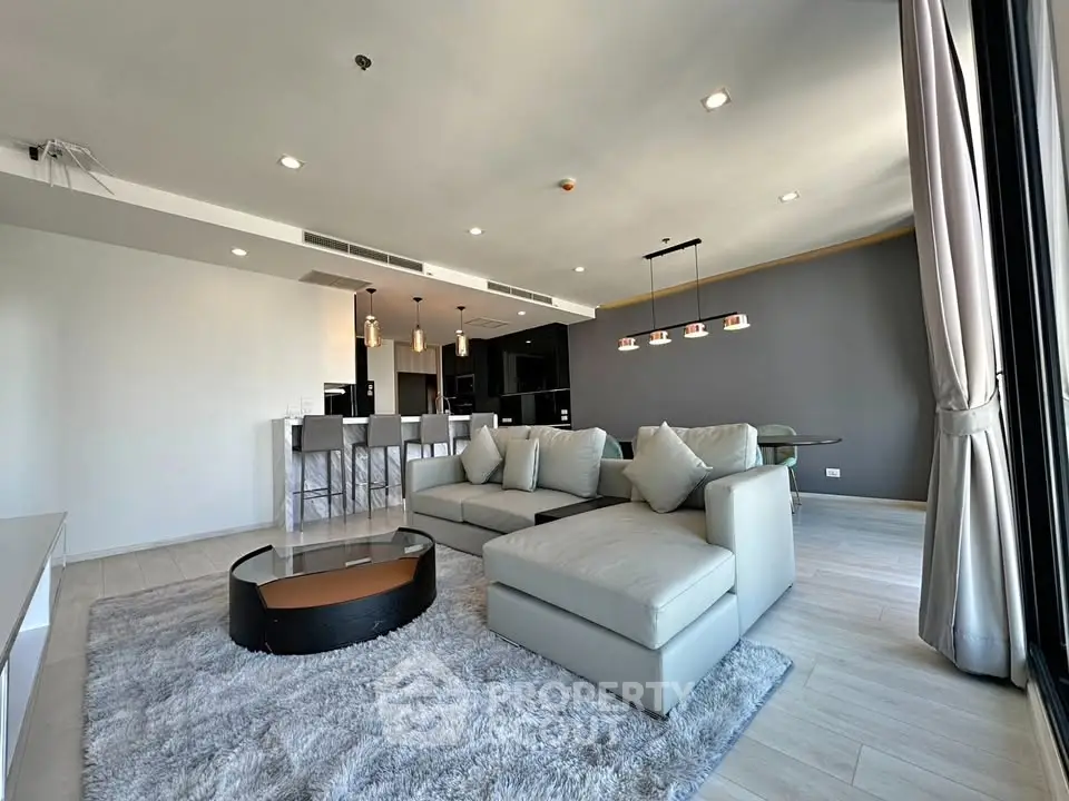 Spacious modern living room with stylish furniture and open layout
