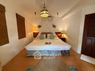 Cozy bedroom with elegant decor and ambient lighting, perfect for relaxation and comfort.