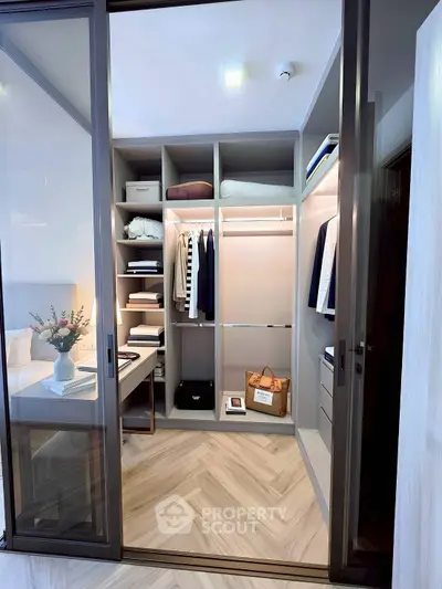 Spacious walk-in closet with elegant shelving and ample storage space