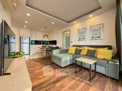 Modern living room with stylish decor and open kitchen layout