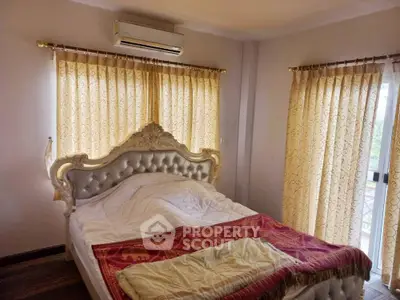 Luxurious bedroom with ornate bed and elegant curtains