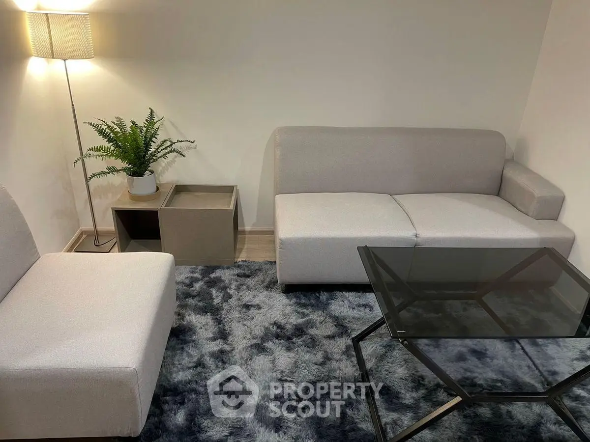 Cozy modern living room with stylish furniture and soft lighting