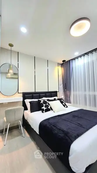 Modern bedroom with stylish decor and natural light