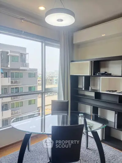Modern study room with glass table and city view, perfect for productivity and inspiration.