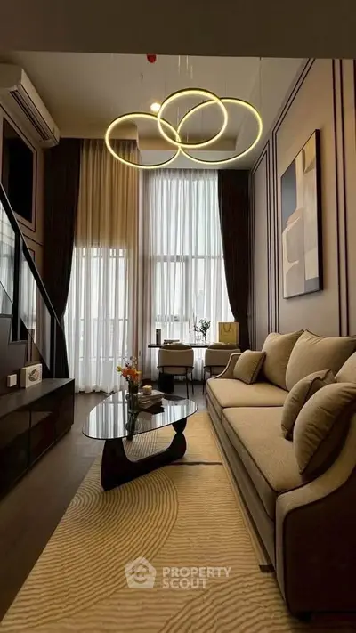 Luxurious modern living room with high ceilings and elegant lighting