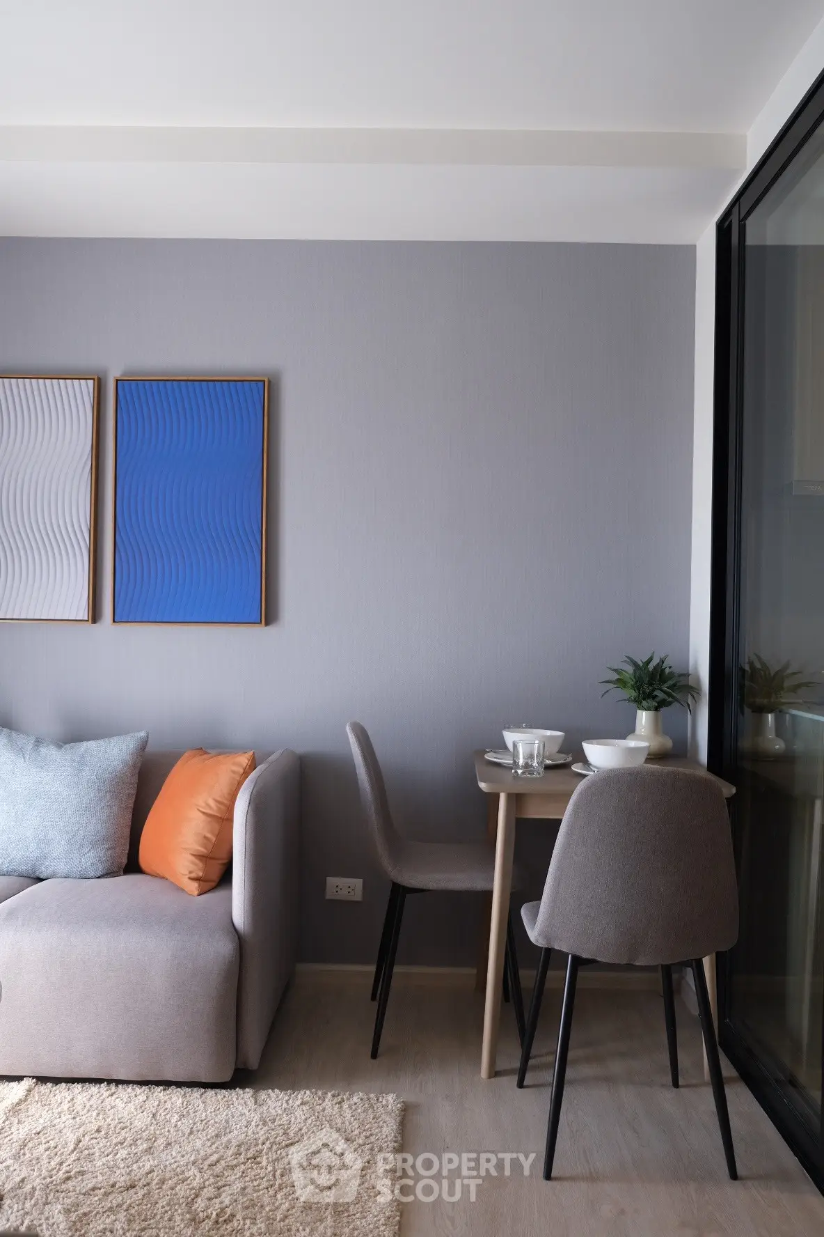 Modern living room with stylish decor and cozy seating area, perfect for relaxation and entertaining.