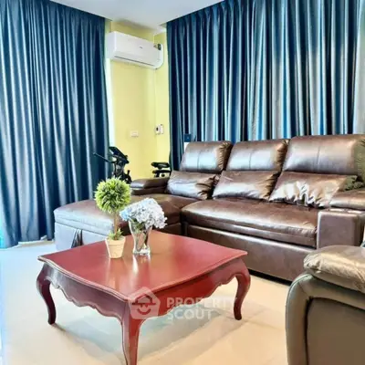 Luxurious living room with leather sofa and elegant decor