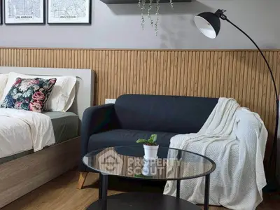 Cozy bedroom with stylish decor and comfortable seating area