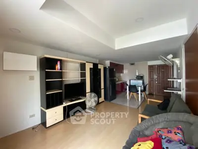 Spacious living room with modern furniture and open kitchen layout