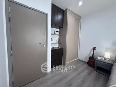 Modern bedroom with sleek storage and cozy decor, perfect for relaxation and style.