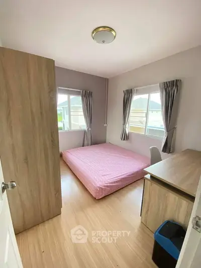 Cozy bedroom with natural light and minimalist decor