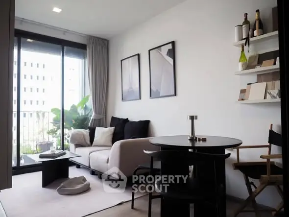 Modern living room with stylish decor and balcony view in urban apartment
