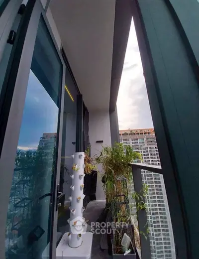 Modern balcony with urban view and vertical garden in high-rise apartment