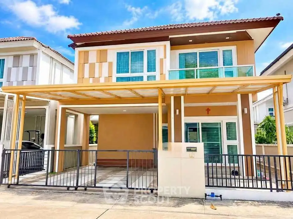 Modern two-story house with a stylish facade and spacious driveway in a suburban neighborhood.
