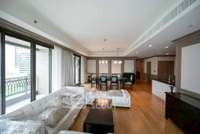 Spacious modern living room with elegant dining area and large windows