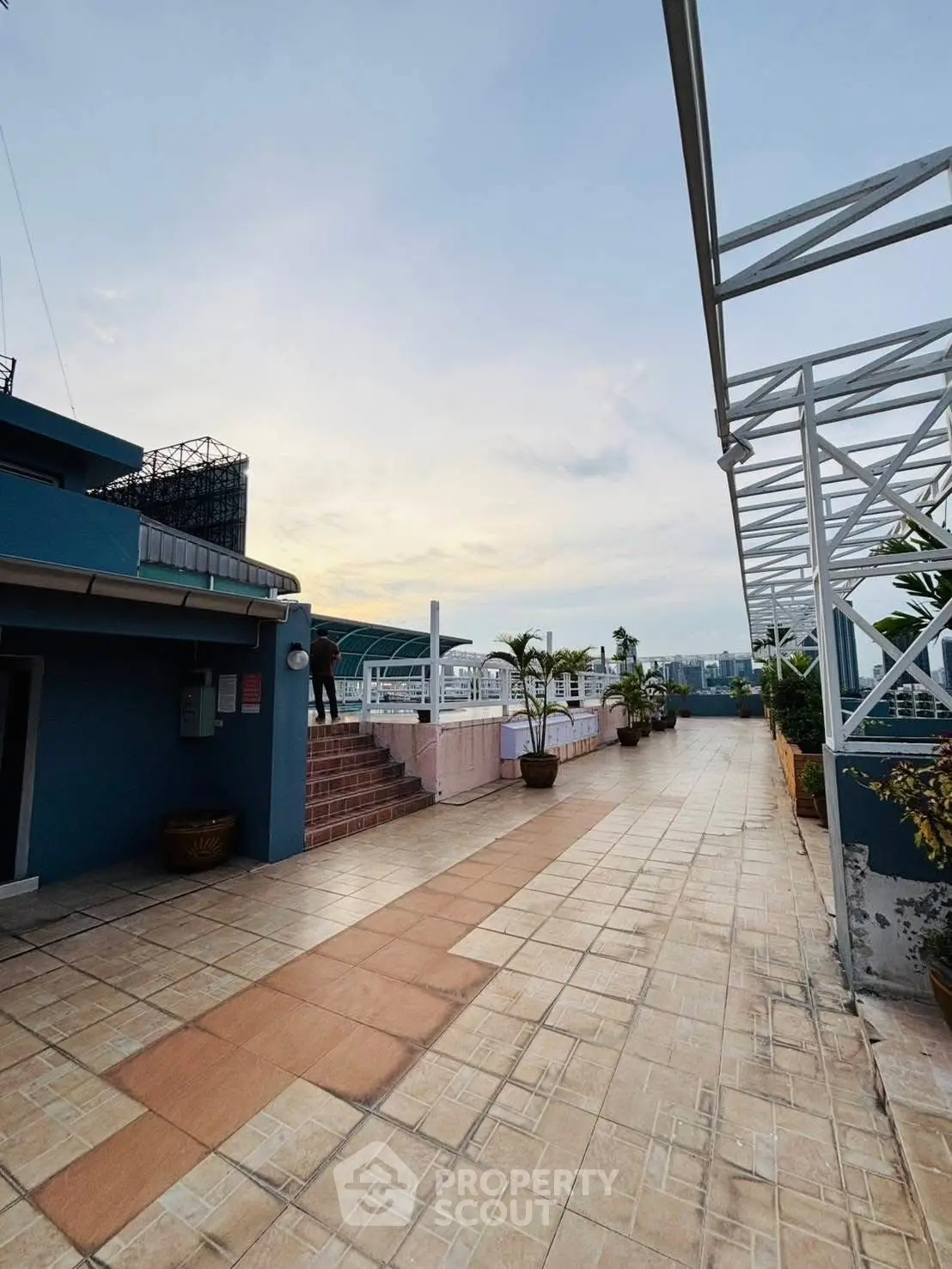 Spacious rooftop terrace with panoramic city views and modern design.