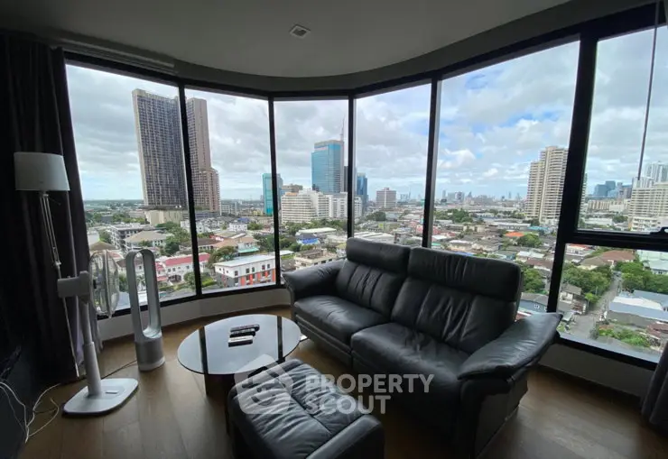 Luxurious living room with panoramic city view and modern furnishings