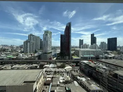 Stunning cityscape view showcasing modern skyscrapers and urban landscape under a clear blue sky.