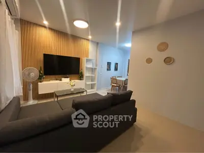 Modern living room with stylish decor and open dining area