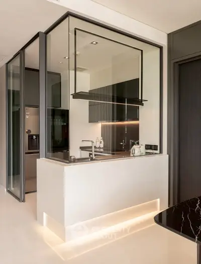 Modern kitchen with sleek design and ambient lighting