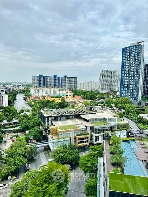 Stunning cityscape view with modern high-rise buildings and lush greenery.