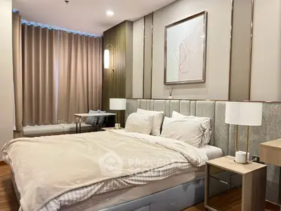 Luxurious bedroom with elegant decor and cozy ambiance, featuring plush bedding and stylish lighting.