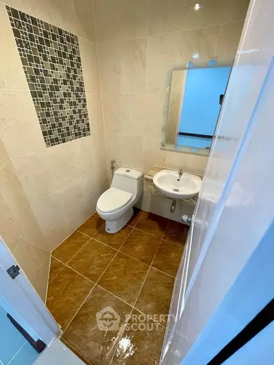 Modern bathroom with elegant tile design and sleek fixtures