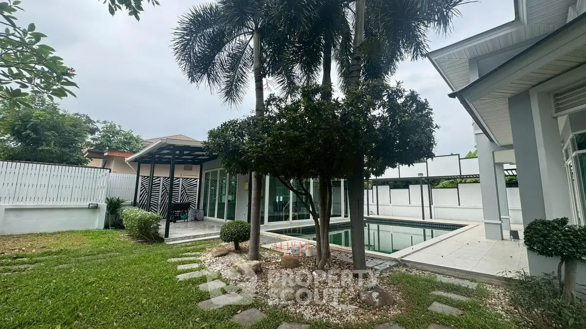 Luxurious home with private pool and lush garden, perfect for relaxation and entertaining.