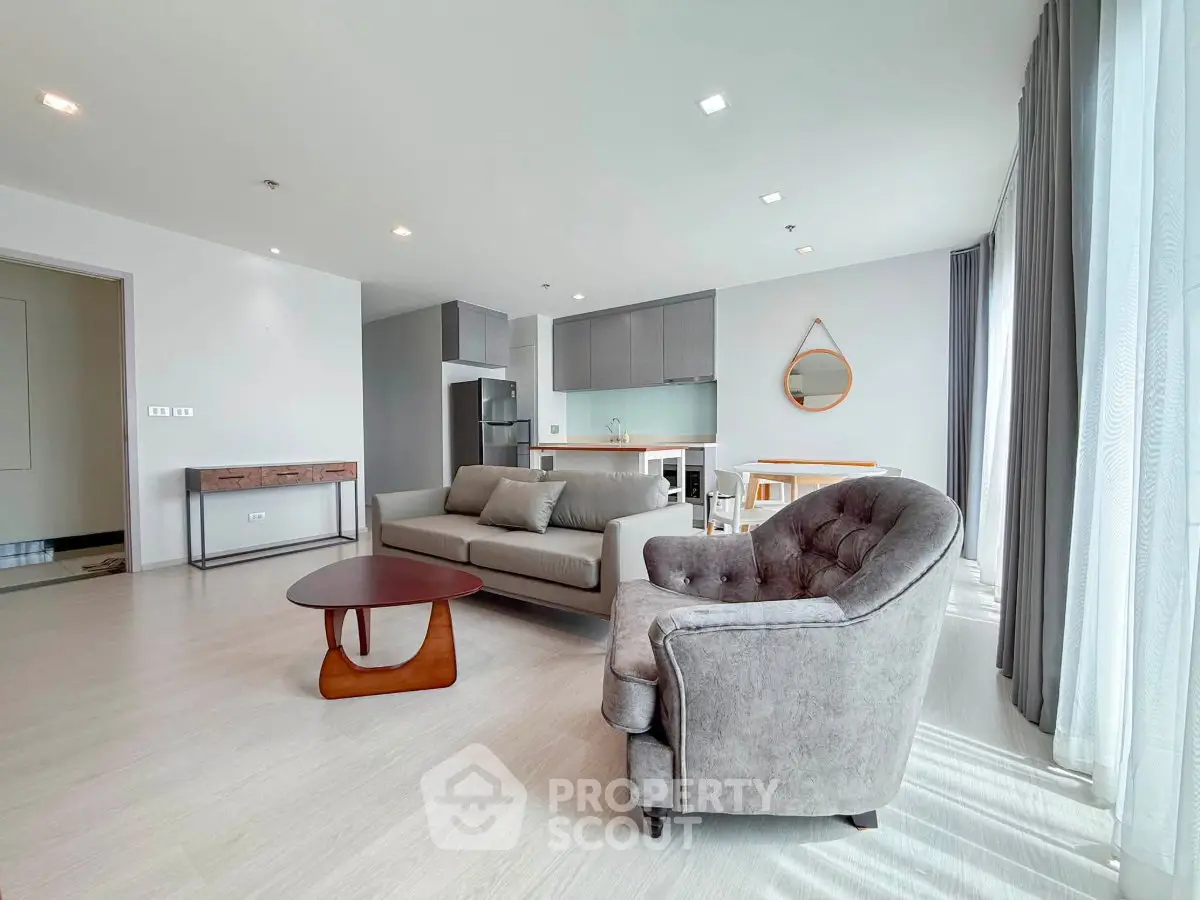 Spacious modern living room with stylish furniture and natural light