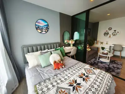Modern bedroom with stylish decor and cozy workspace