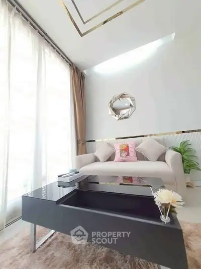 Elegant living room with modern decor and natural light