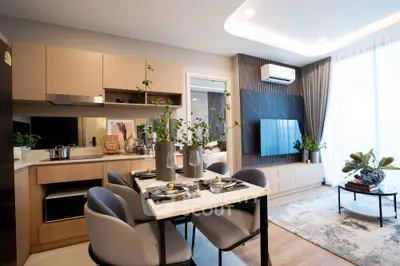 Modern open-plan living room with stylish dining area and sleek kitchen design