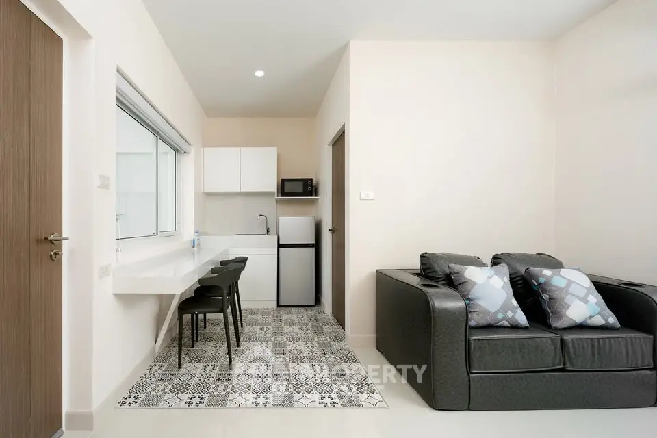 Modern studio apartment with stylish kitchen and cozy living area