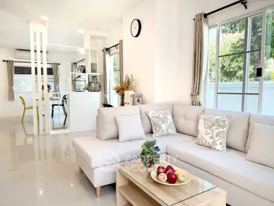 Spacious modern living room with elegant decor and natural light