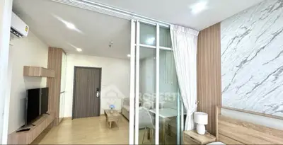 Modern living room with sliding glass doors and stylish decor