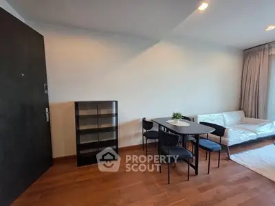 Modern living room with sleek furniture and wooden flooring, perfect for stylish urban living.